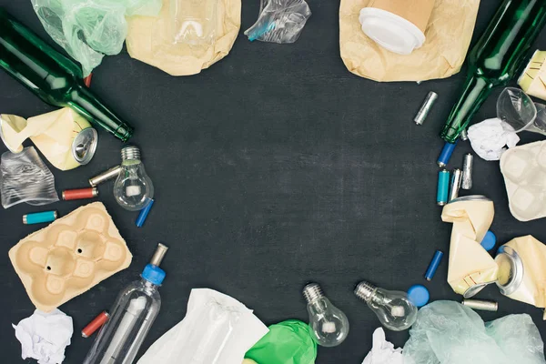 Frame of various types of trash on black — Stock Photo
