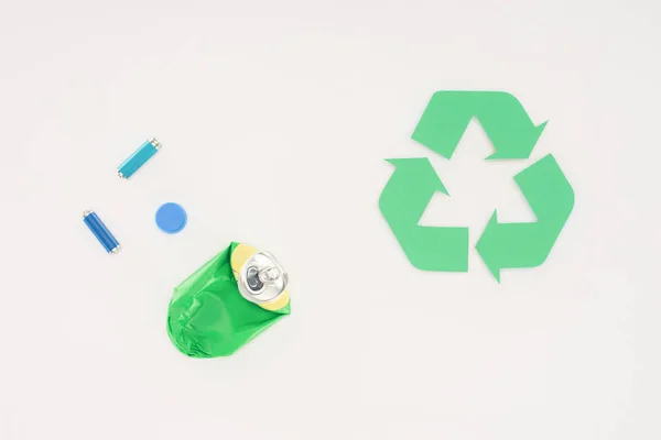 Top view of various trash with recycle sign on white — Stock Photo