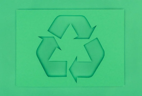 Top view of green recycle sign with arrows — Stock Photo