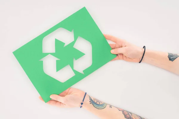 Cropped shot of woman holding placard with recycle sign on white — Stock Photo