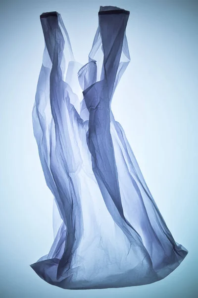 Bolsa de plástico transparente vacía bajo luz tonificada colorida — Stock Photo