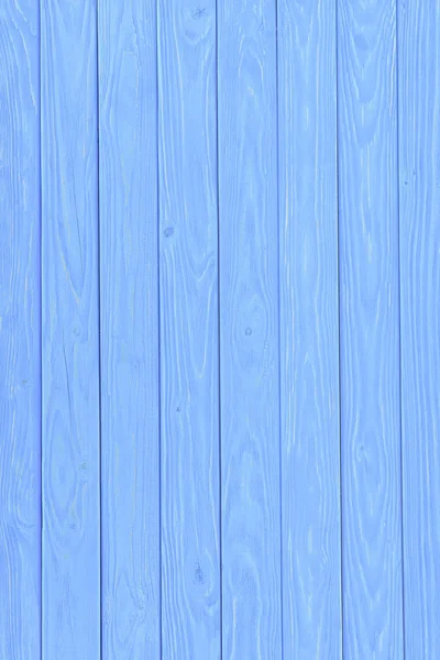 Planches verticales en bois peintes en fond bleu — Photo de stock