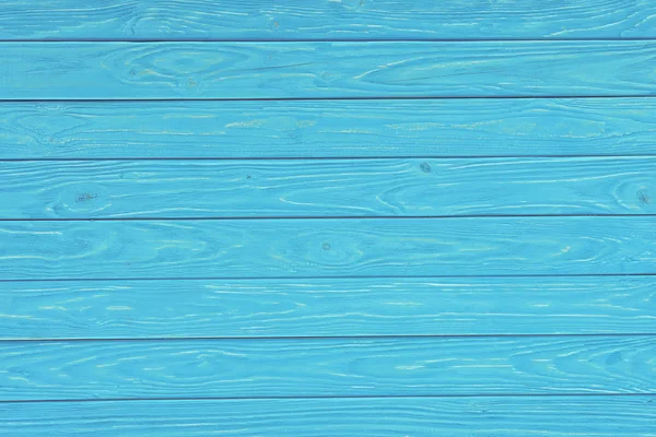 Tábuas de madeira pintadas em fundo turquesa — Fotografia de Stock