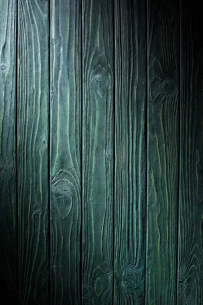 Wooden planks painted in green background — Stock Photo