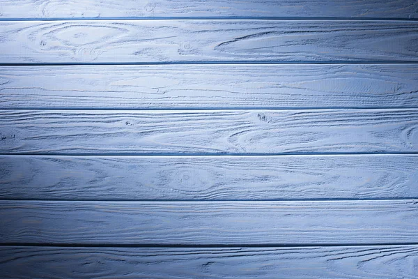 Planches en bois peintes en fond cyan — Photo de stock