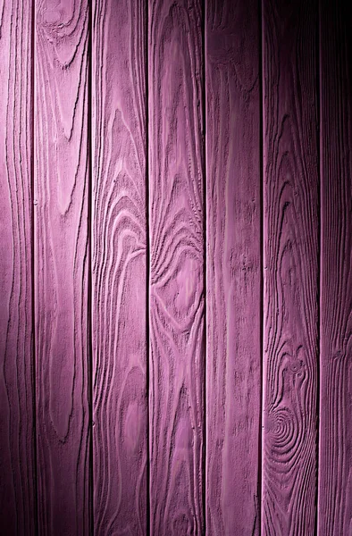 Tábuas de madeira pintadas em fundo roxo — Fotografia de Stock