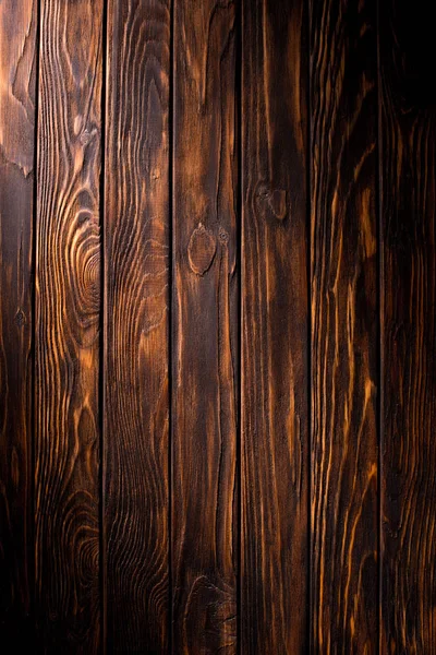 Planches en bois peintes en fond marron — Photo de stock