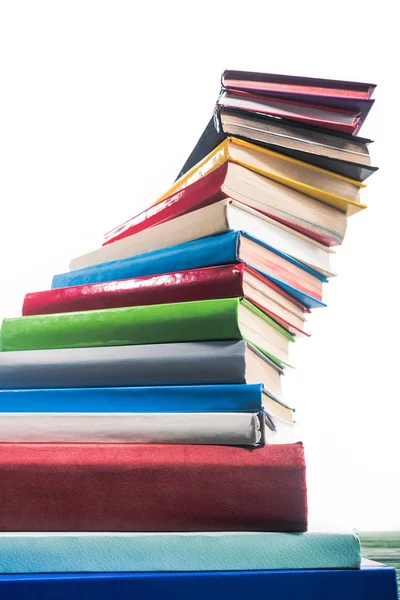 Spiral tower of colorful stacked books — Stock Photo