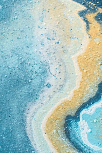 Close up of abstract background with light blue and yellow acrylic paint — Stock Photo