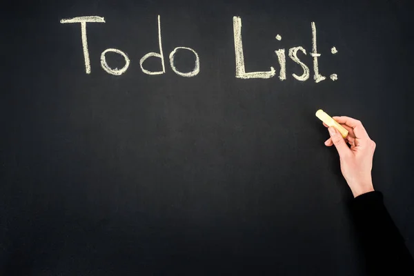 Hand writing to do list inscription on chalkboard — Stock Photo