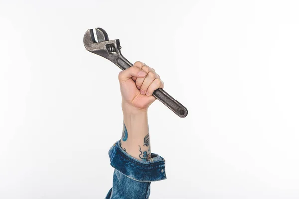 Cropped image of male hand holding adjustable wrench isolated on white — Stock Photo