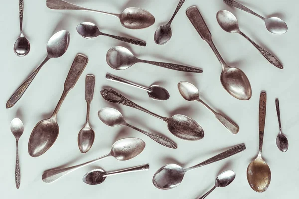 Vintage metal spoons on white background — Stock Photo