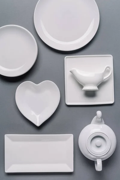 White tableware for dinner time on grey background — Stock Photo