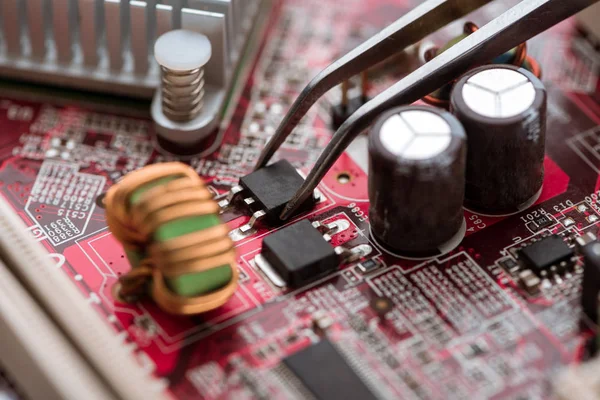 Assembling digital circuit board with microchips and components — Stock Photo