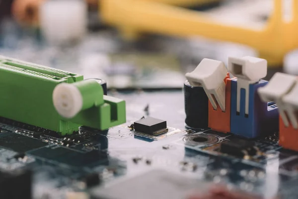 Standard motherboard with electrolytic capacitors and elements — Stock Photo