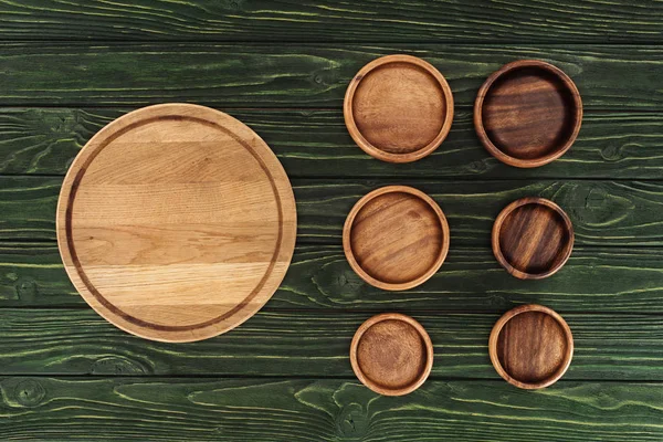 Various types of wooden round cutting boards on table — Stock Photo