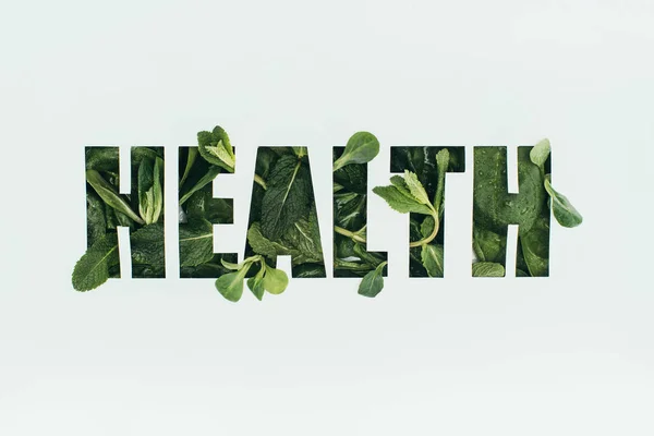 Word health made of fresh green leaves isolated on grey — Stock Photo