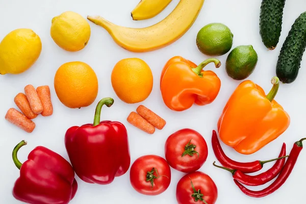 Top view of colored ripe vegetables and fruits isolated on white — Stock Photo