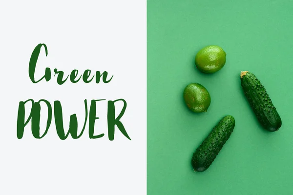 Top view of limes and cucumbers with text Green Power on white and green surface — Stock Photo