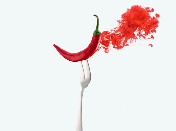 Red chili pepper on fork and red ink isolated on white — Stock Photo