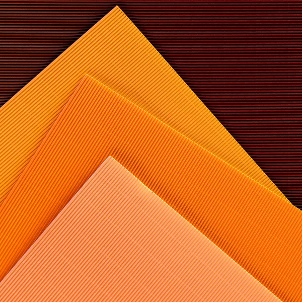 Vue de dessus des feuilles colorées disposées de fond de papier — Photo de stock