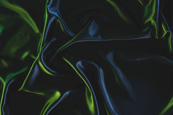 Полный кадр из темно-элегантной шелковой ткани в качестве фона — стоковое фото