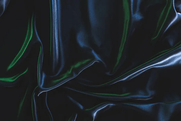 Full frame of dark elegant silk fabric as background — Stock Photo