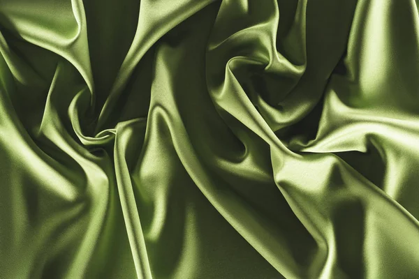 Close up view of elegant green silk cloth as backdrop — Stock Photo