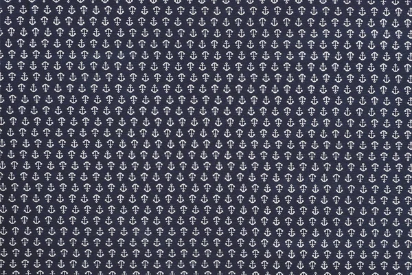 Full frame of blue fabric with white anchors ornament backdrop — Stock Photo