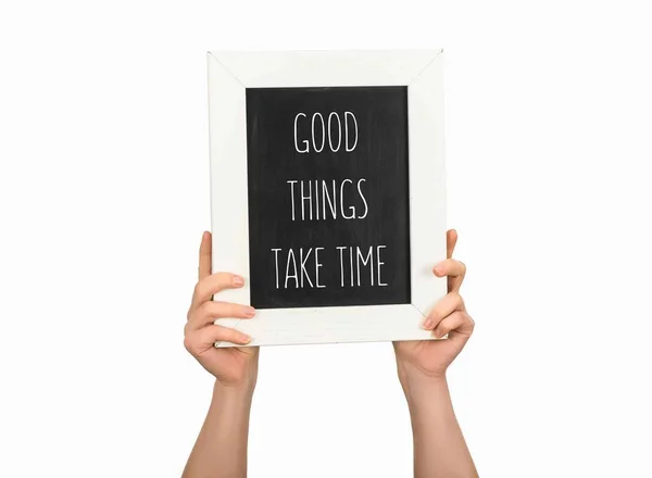 Cropped view of woman holding chalkboard with inscription good things take time isolated on white — Stock Photo