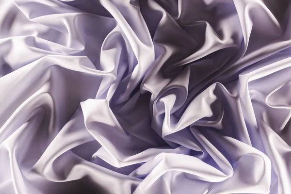 Full frame of folded elegant purple silk fabric as background — Stock Photo
