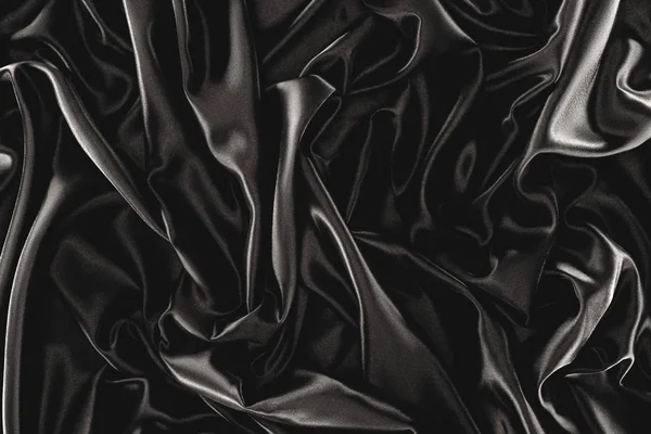 Полная рамка из черной элегантной шелковой ткани в качестве фона — стоковое фото
