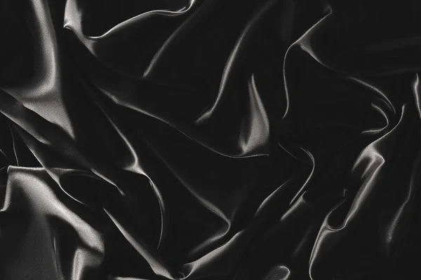 Plein cadre de tissu de soie élégant noir comme fond — Photo de stock