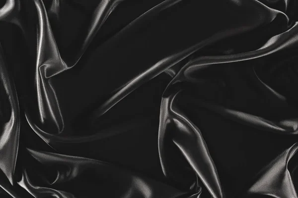 Full frame of black elegant silk cloth as background — Stock Photo