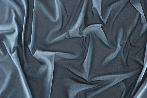 Vista de perto de tecido de seda azul amassado como fundo — Fotografia de Stock