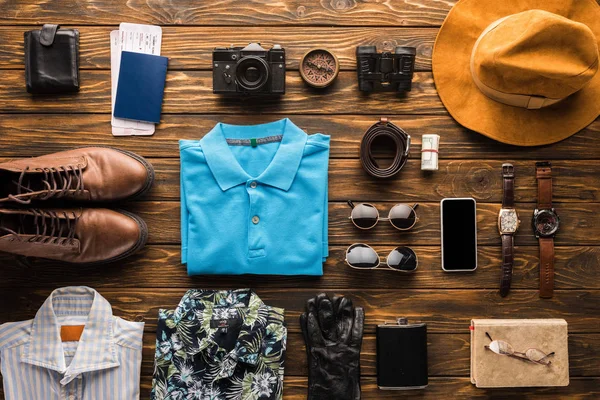 Top view of traveller stuff kit on rustic wooden surface — Stock Photo