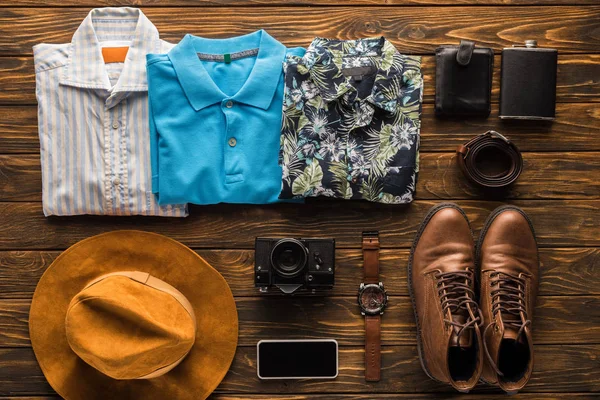 Top view of stylish traveller stuff kit on rustic wooden tabletop — Stock Photo