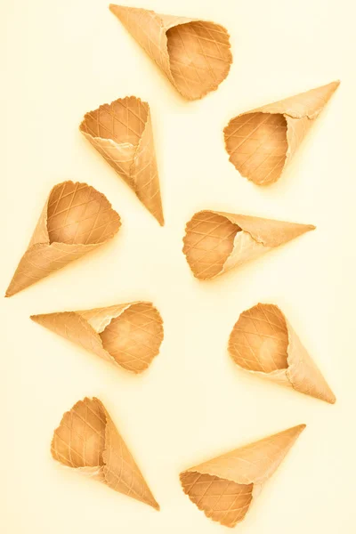 Top view of ice cream cones isolated on yellow — Stock Photo