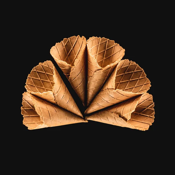 Top view of delicious ice cream cones isolated on black — Stock Photo