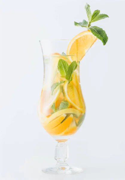 Close up view of summer fresh cocktail with mint and pieces of citrus fruits isolated on white — Stock Photo