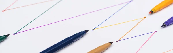 Panoramic shot of colorful felt-tip pens on white background with connected drawn lines, connection and communication concept — Stock Photo