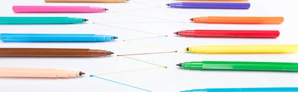 Selective focus of felt-tip pens on white background with connected drawn lines, connection and communication concept — Stock Photo