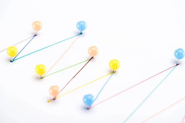 Close up view of colorful connected drawn lines with pins, connection concept — Stock Photo