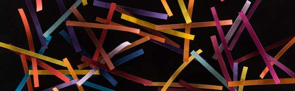 Top view of multicolored abstract lines scattered isolated on black background, connection and communication concept — Stock Photo