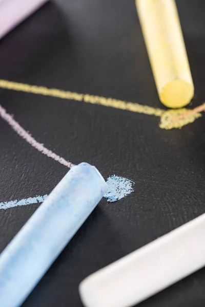 Close up view of colorful chalk on black surface with connected drawn lines, connection and communication concept — Stock Photo