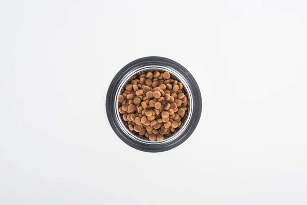 Top view of dry pet food in silver bowl isolated on white — Stock Photo