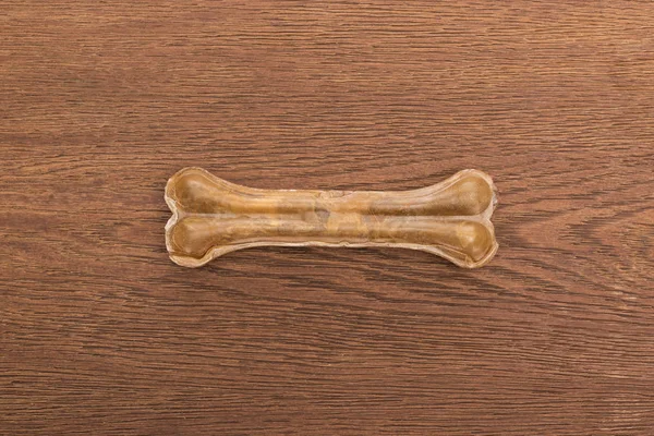 Top view of pet bone on wooden table — Stock Photo