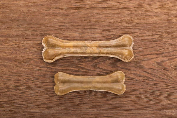 Top view of pet bones on wooden table — Stock Photo