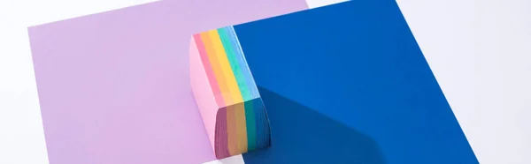 Panoramic shot of colorful papers and sticky notes on white background — Stock Photo