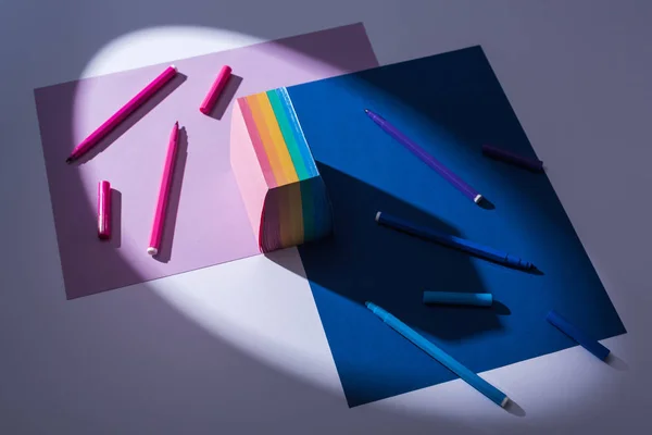 High angle view of papers, sticky notes and felt tip pens on white background — Stock Photo